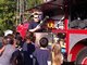 FireFighter Darryl Boone shows students fire equipment